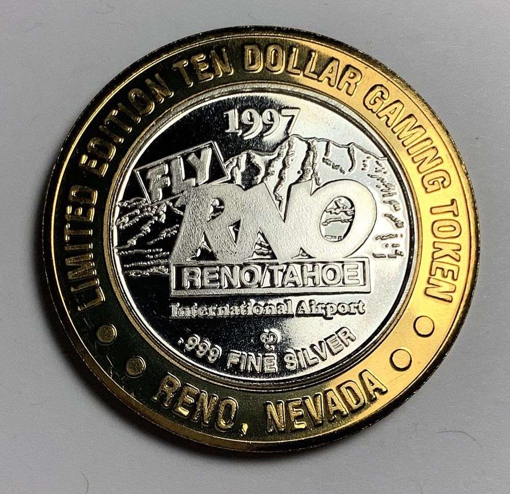 1997 Reno/Tahoe International Airport $10 Skiing Casino Token: Winner shall receive the exact coin shown here. (NH/TVC=B)