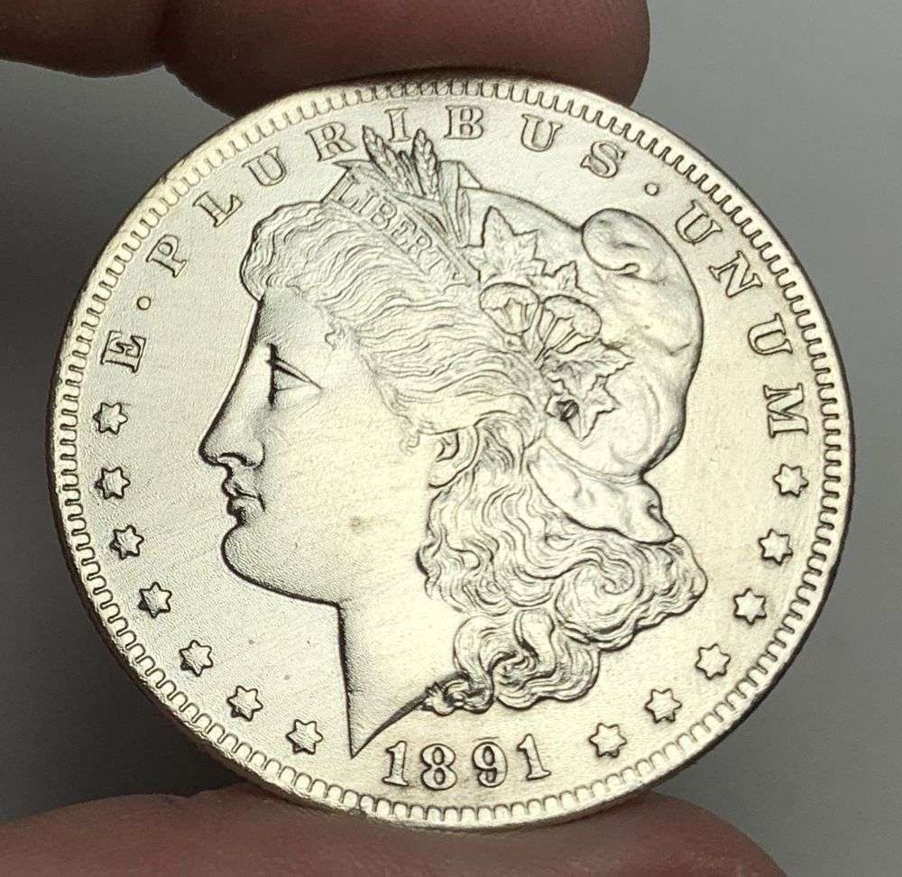 1891-CC Morgan Silver Dollar MS62 Details: This is the story about two coin dealers, a partnership. One, the largest bullion dealer north of San Francisco, and the other, the largest rare coin dealer north of San Francisco. Together, their sho