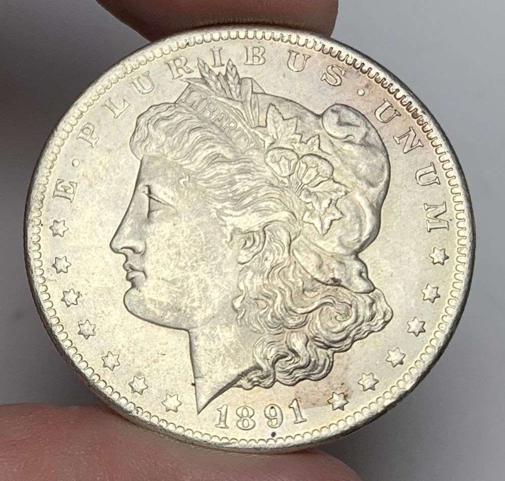 1891-CC Morgan Silver Dollar MS63: This is the story about two coin dealers, a partnership. One, the largest bullion dealer north of San Francisco, and the other, the largest rare coin dealer north of San Francisco. Together, their sho
