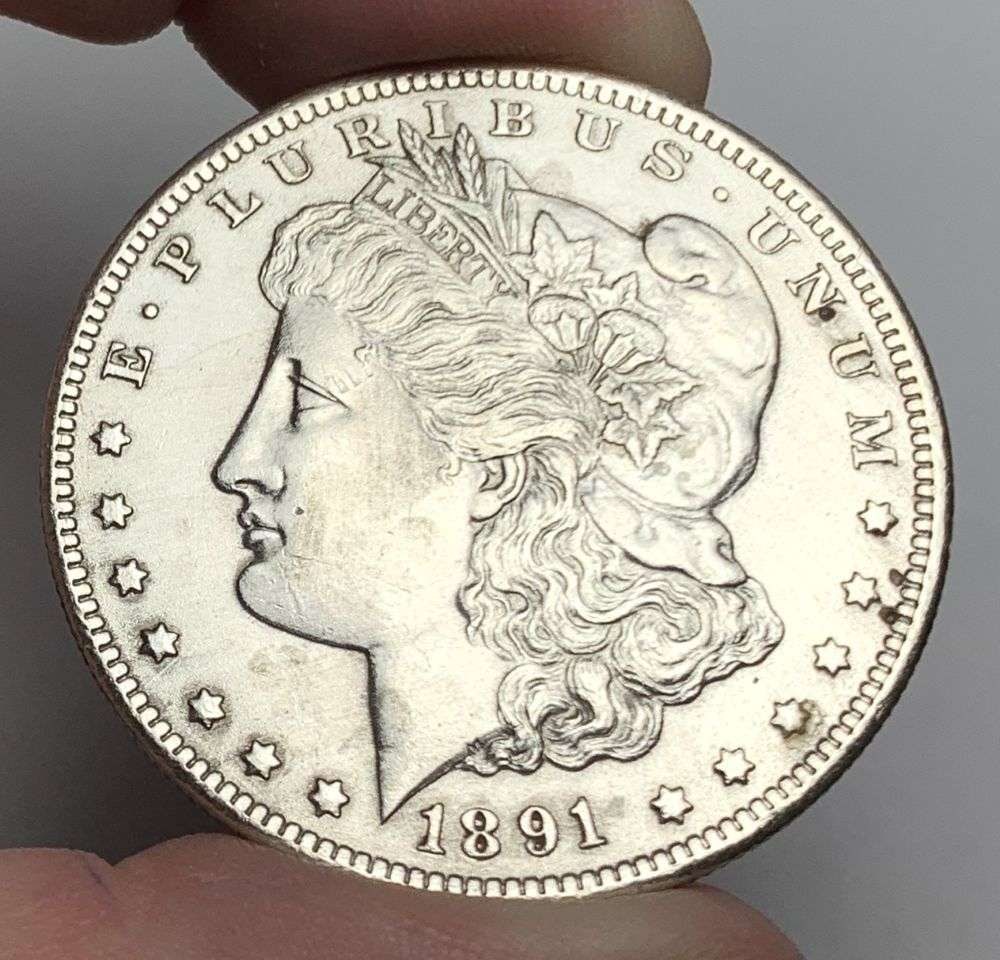 1891-CC Morgan Silver Dollar MS62 Details: This is the story about two coin dealers, a partnership. One, the largest bullion dealer north of San Francisco, and the other, the largest rare coin dealer north of San Francisco. Together, their sho