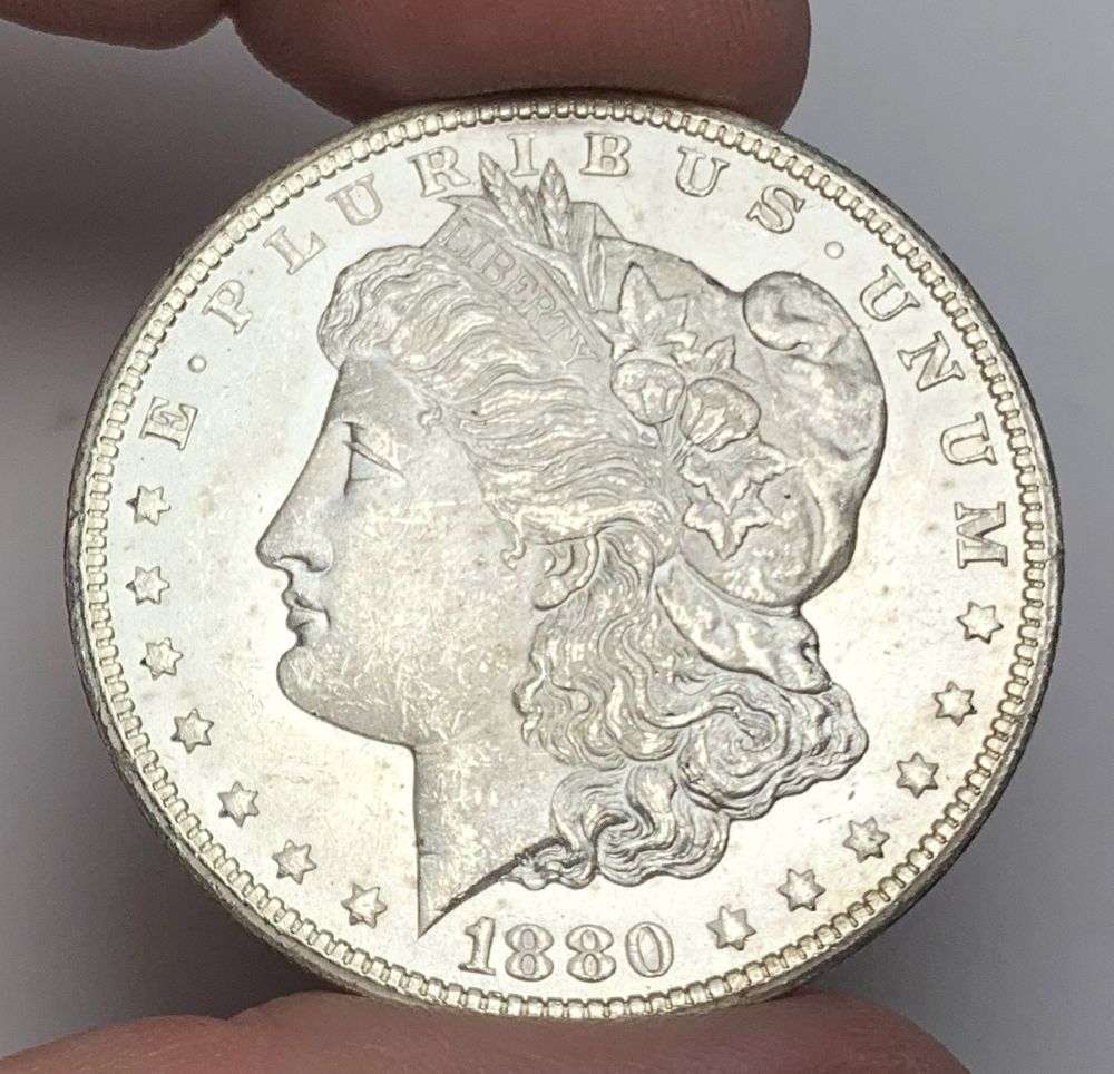 1880-CC Morgan Silver Dollar MS64 REV 78: This is the story about two coin dealers, a partnership. One, the largest bullion dealer north of San Francisco, and the other, the largest rare coin dealer north of San Francisco. Together, their sho