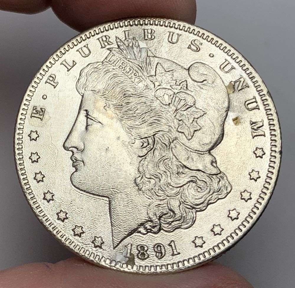 1891-CC Morgan Silver Dollar MS62 Details: This is the story about two coin dealers, a partnership. One, the largest bullion dealer north of San Francisco, and the other, the largest rare coin dealer north of San Francisco. Together, their sho