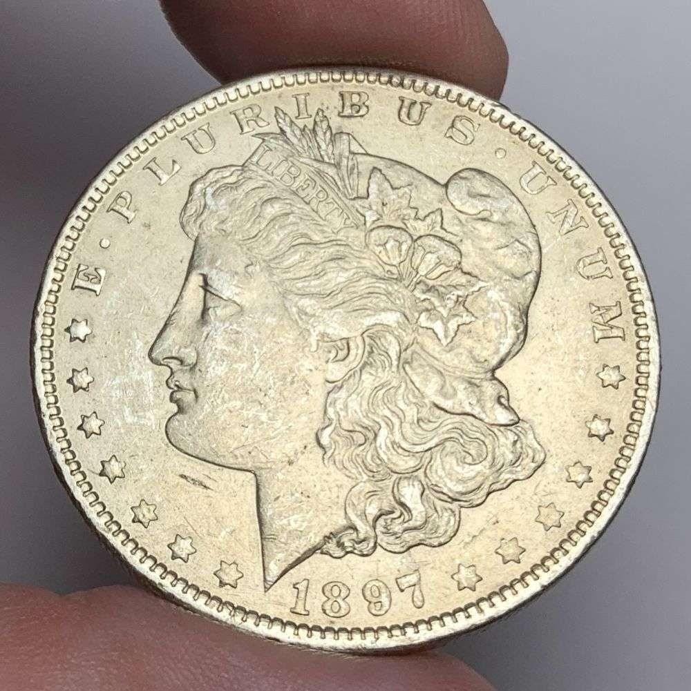 1897-O Morgan Silver Dollar AU50: Winner shall receive the exact coin shown here. (MR/B)