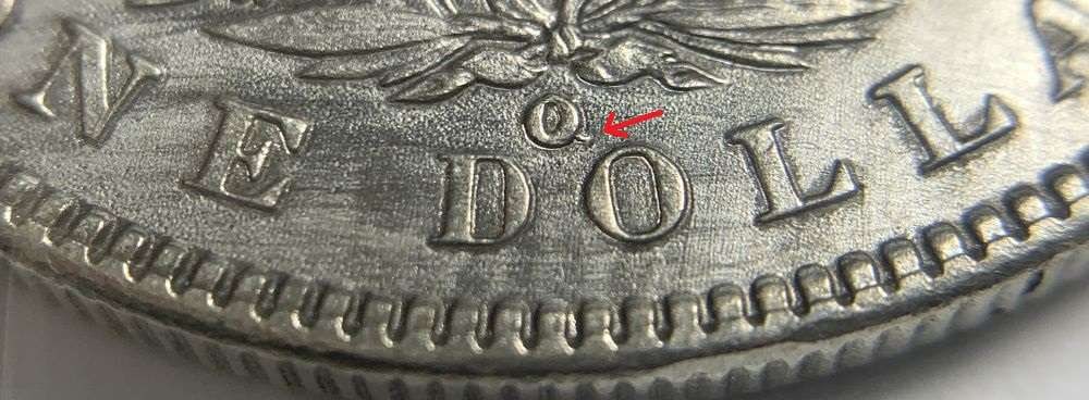 1900-O/CC Morgan Silver Dollar AU50 Details: This is the story about two coin dealers, a partnership. One, the largest bullion dealer north of San Francisco, and the other, the largest rare coin dealer north of San Francisco. Together, their sho