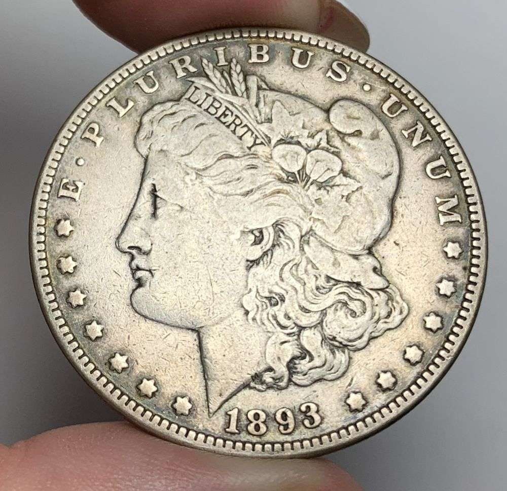 1893 Morgan Silver Dollar VF: This is the story about two coin dealers, a partnership. One, the largest bullion dealer north of San Francisco, and the other, the largest rare coin dealer north of San Francisco. Together, their sho