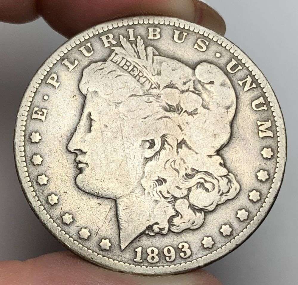 1893-O Morgan Silver Dollar Fine Details: This is the story about two coin dealers, a partnership. One, the largest bullion dealer north of San Francisco, and the other, the largest rare coin dealer north of San Francisco. Together, their sho