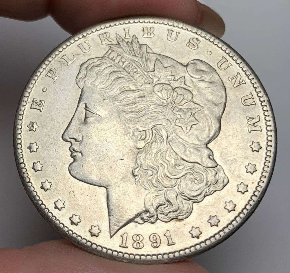 1891-CC Morgan Silver Dollar MS62 Details: This is the story about two coin dealers, a partnership. One, the largest bullion dealer north of San Francisco, and the other, the largest rare coin dealer north of San Francisco. Together, their sho
