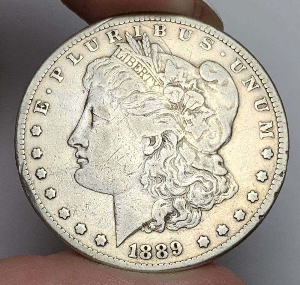 1889-CC Morgan Silver Dollar VF: This is the story about two coin dealers, a partnership. One, the largest bullion dealer north of San Francisco, and the other, the largest rare coin dealer north of San Francisco. Together, their sho