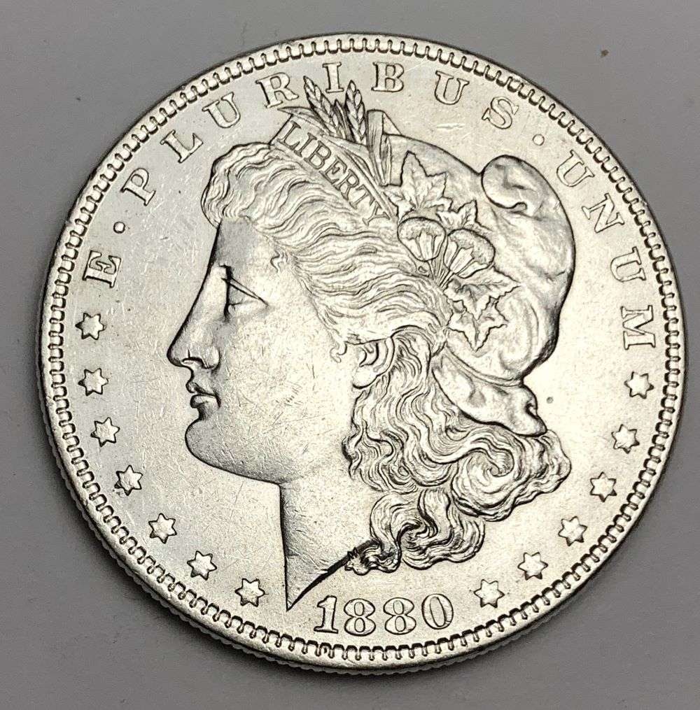 1880-O Morgan Silver Dollar MS62 Details: This is the story about two coin dealers, a partnership. One, the largest bullion dealer north of San Francisco, and the other, the largest rare coin dealer north of San Francisco. Together, their sho