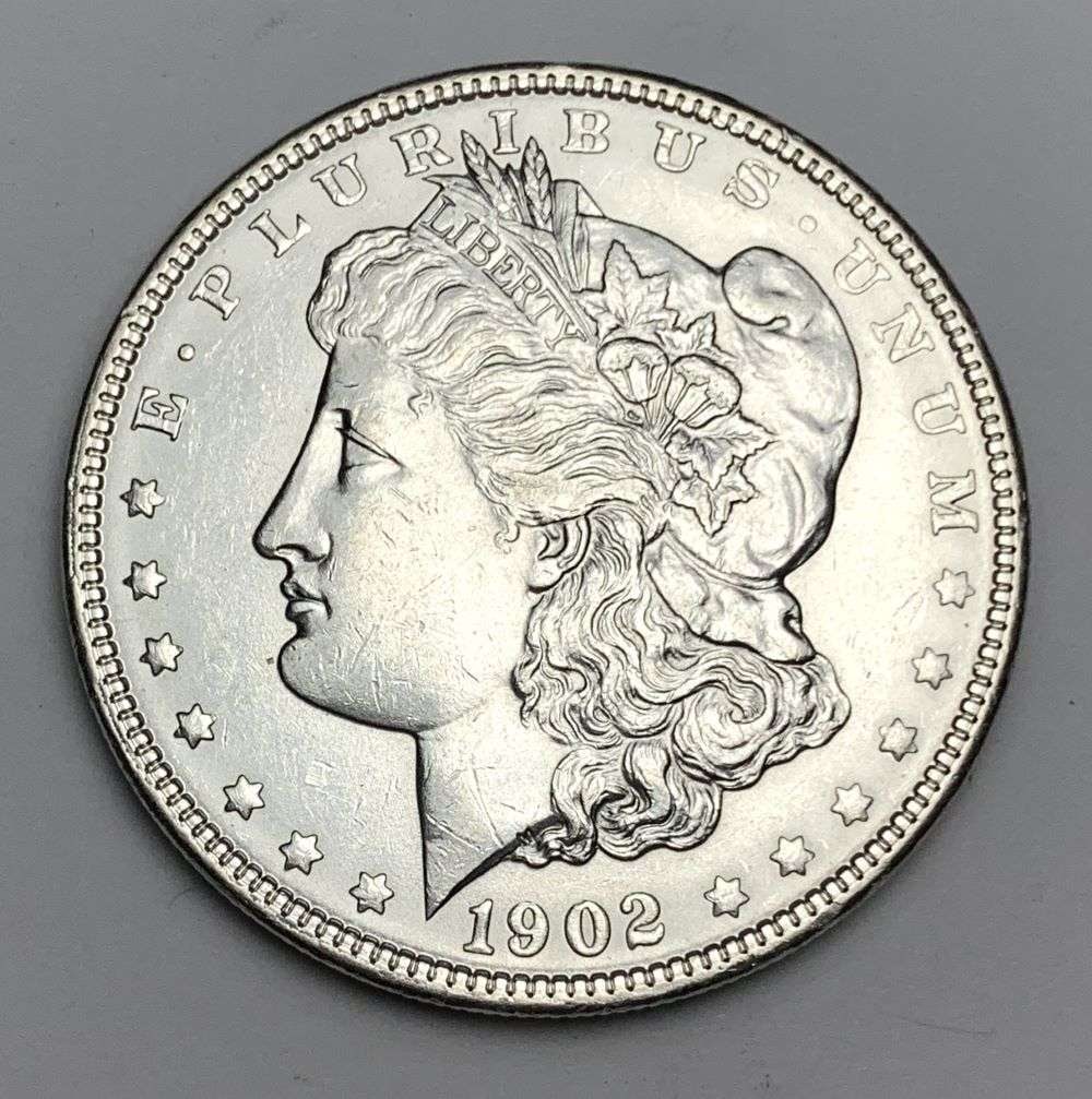 1902 Morgan Silver Dollar MS64 Details: This is the story about two coin dealers, a partnership. One, the largest bullion dealer north of San Francisco, and the other, the largest rare coin dealer north of San Francisco. Together, their sho