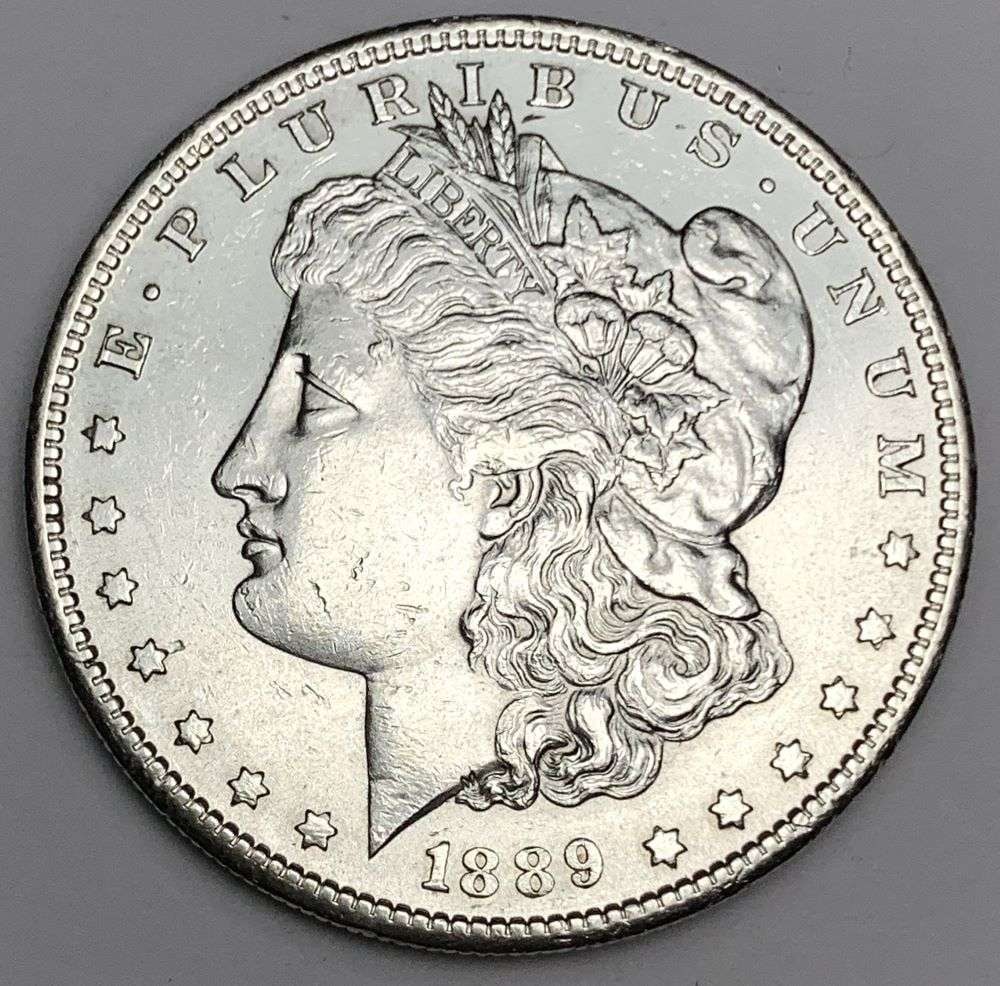 1889-S Morgan Silver Dollar MS63 Details: This is the story about two coin dealers, a partnership. One, the largest bullion dealer north of San Francisco, and the other, the largest rare coin dealer north of San Francisco. Together, their sho