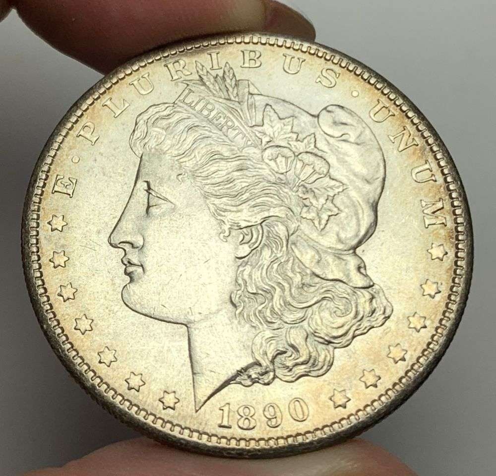 1890-S Morgan Silver Dollar MS64: This is the story about two coin dealers, a partnership. One, the largest bullion dealer north of San Francisco, and the other, the largest rare coin dealer north of San Francisco. Together, their sho
