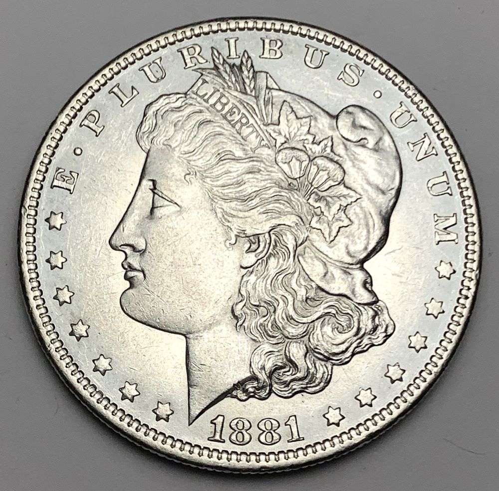 1881-O Morgan Silver Dollar MS64 Details: This is the story about two coin dealers, a partnership. One, the largest bullion dealer north of San Francisco, and the other, the largest rare coin dealer north of San Francisco. Together, their sho