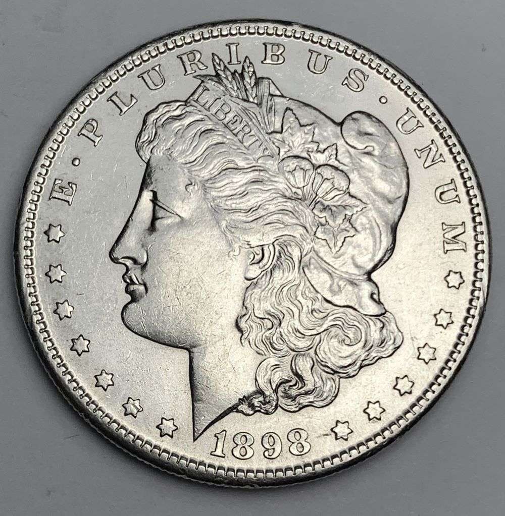 1898-S Morgan Silver Dollar MS64 Details: This is the story about two coin dealers, a partnership. One, the largest bullion dealer north of San Francisco, and the other, the largest rare coin dealer north of San Francisco. Together, their sho