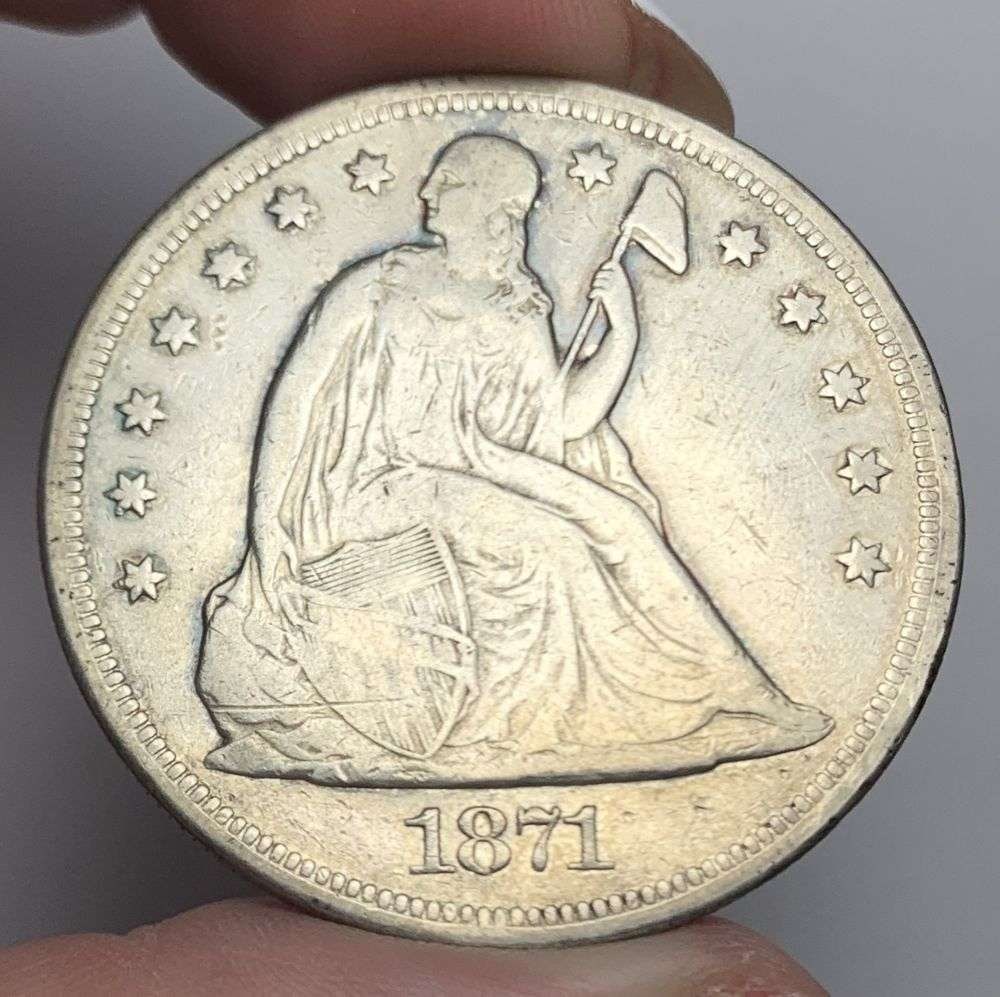 1871 Seated Liberty Silver Dollar VF: Winner shall receive the exact coin shown here. (MR/POB)