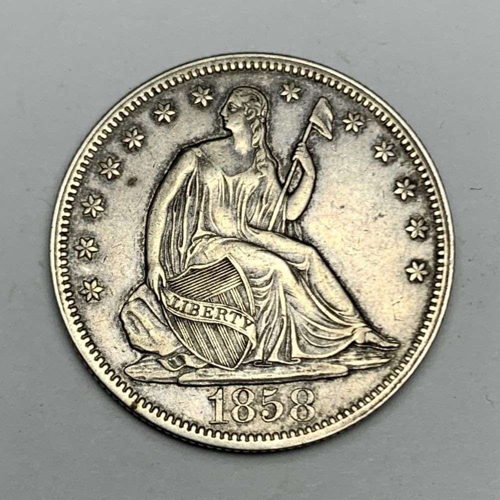 1858 Seated Liberty Silver Half Dollar AU58: This is the story about two coin dealers, a partnership. One, the largest bullion dealer north of San Francisco, and the other, the largest rare coin dealer north of San Francisco. Together, their sho