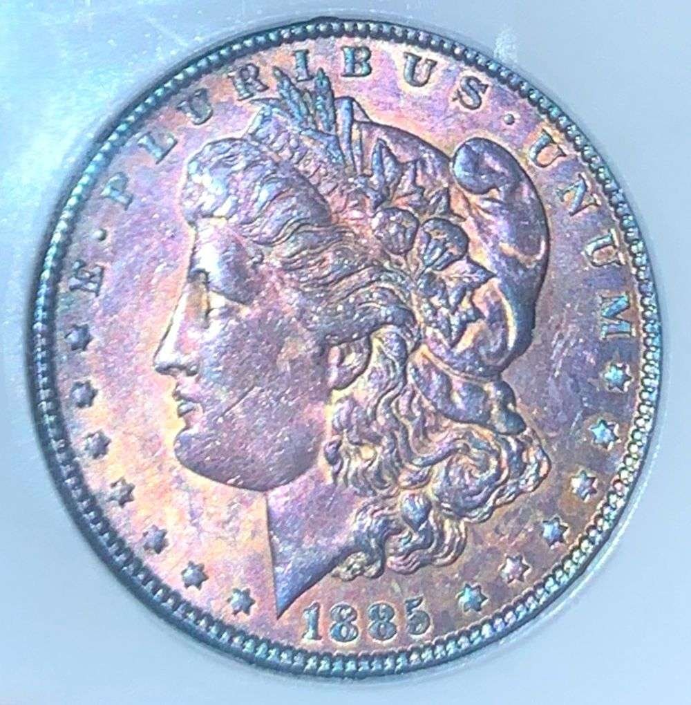 Last Minute Toner! 1885 Morgan Silver Dollar MS65+: IMPORTANT NOTE: We do not agree with the grade provided with this "off-brand" grading company. Winner shall receive the exact coin shown here. (NH/LBB)