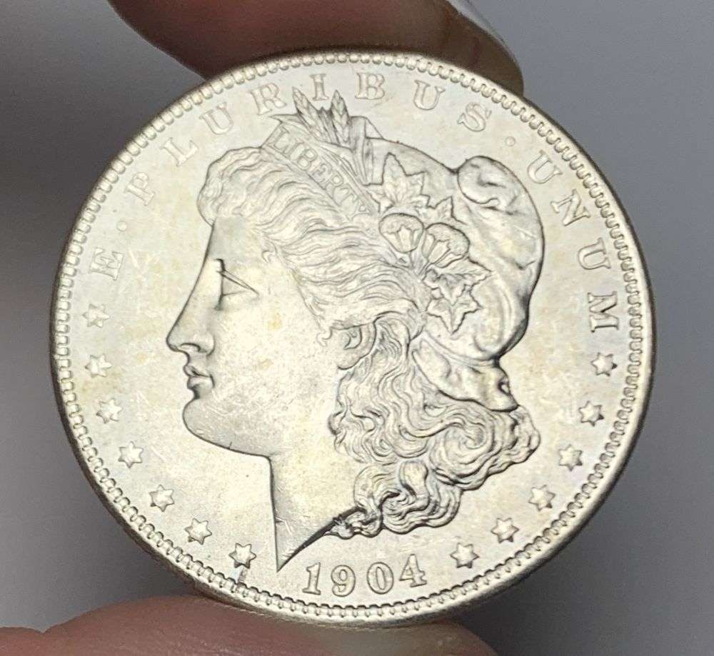 1904-O Morgan Silver Dollar MS64: Winner shall receive the exact coin shown here. (MR/B)