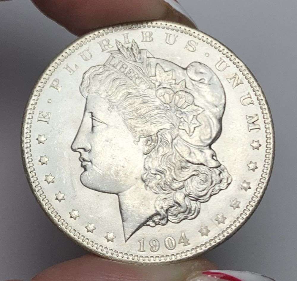 1904-O Morgan Silver Dollar MS64: Winner shall receive the exact coin shown here. (MR/B)