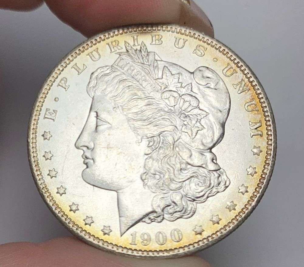 1900-O Morgan Silver Dollar MS64: Winner shall receive the exact coin shown here. (MR/OB)