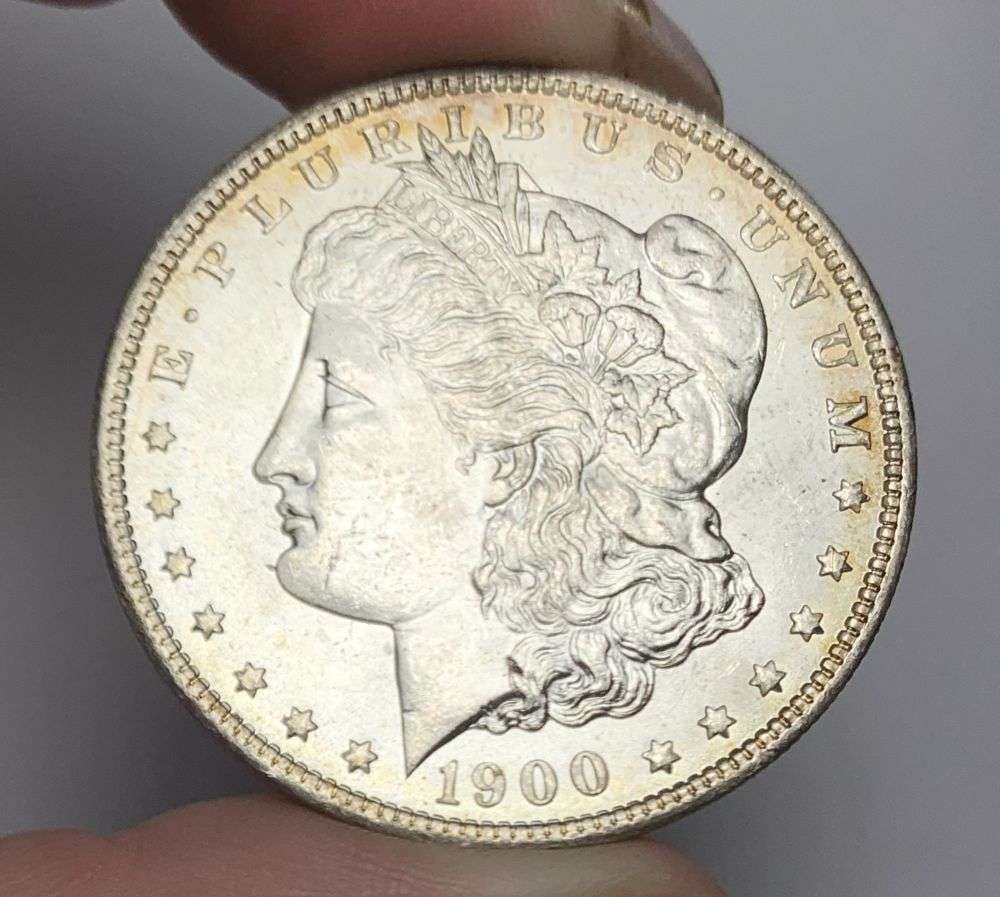 1900-O Morgan Silver Dollar MS63: Winner shall receive the exact coin shown here. (MR/OB)