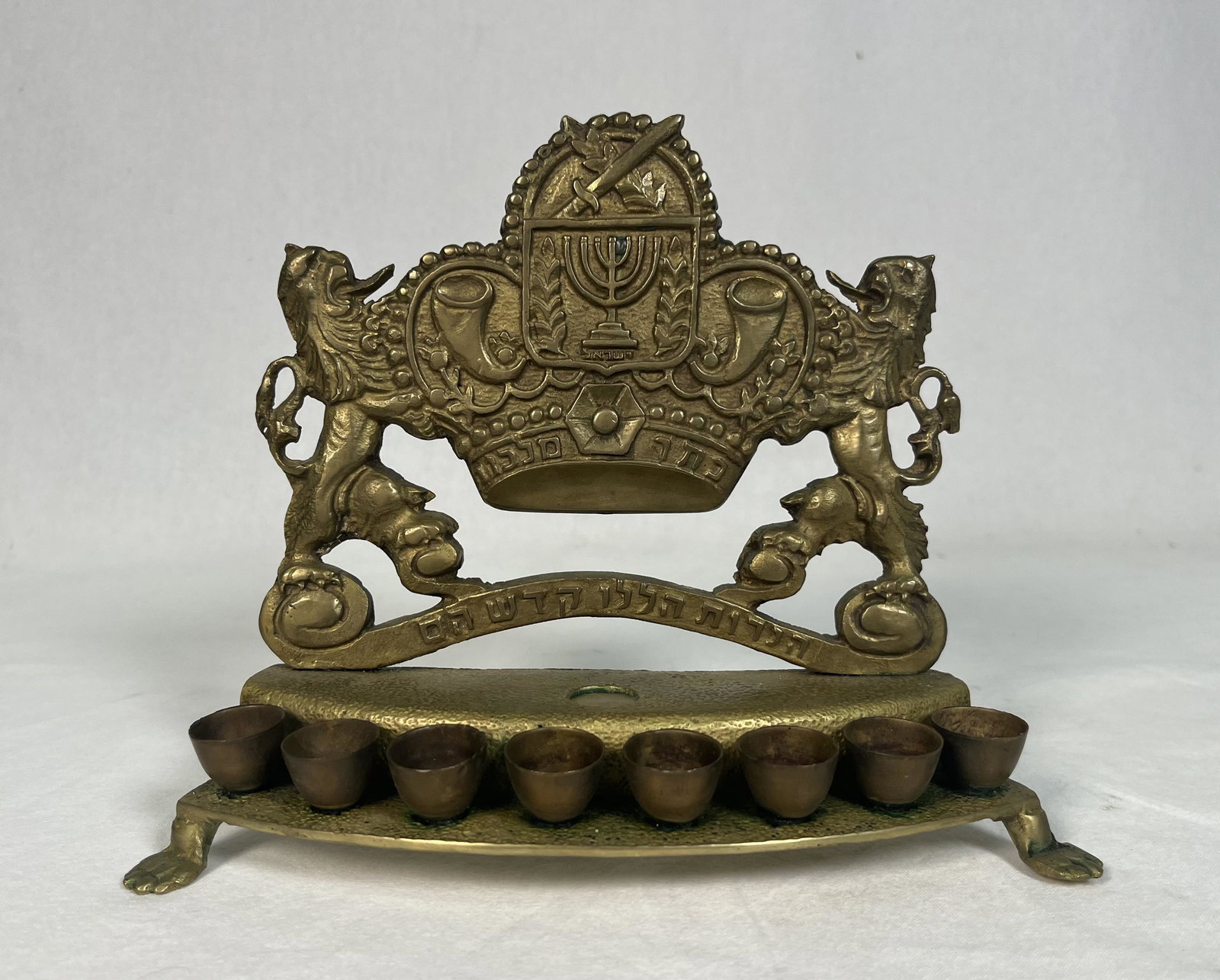 Antique Bronze Hanukkah Lamp Menorah Judaica: Antique Bronze Footed Hanukkah Menorah Lamp Writing in Hebrew with Rifle Bayonet or Short Sword Dagger Zionist Lion Motif Jewish " 7" H x 9" L Please Look at Photos Closely Out of a Long Island Estate