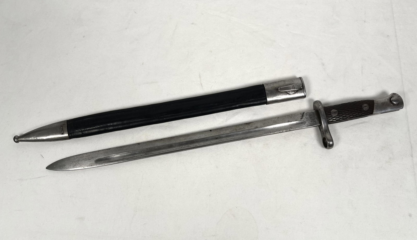 WWI German Mauser Rifle Bayonet with Scabbard: WWI or WWII German Military Mauser Rifle Bayonet with Leather Scabbard Marked 22" L Blade 16" L Please look at Photos Closely Out of a New York City Estate