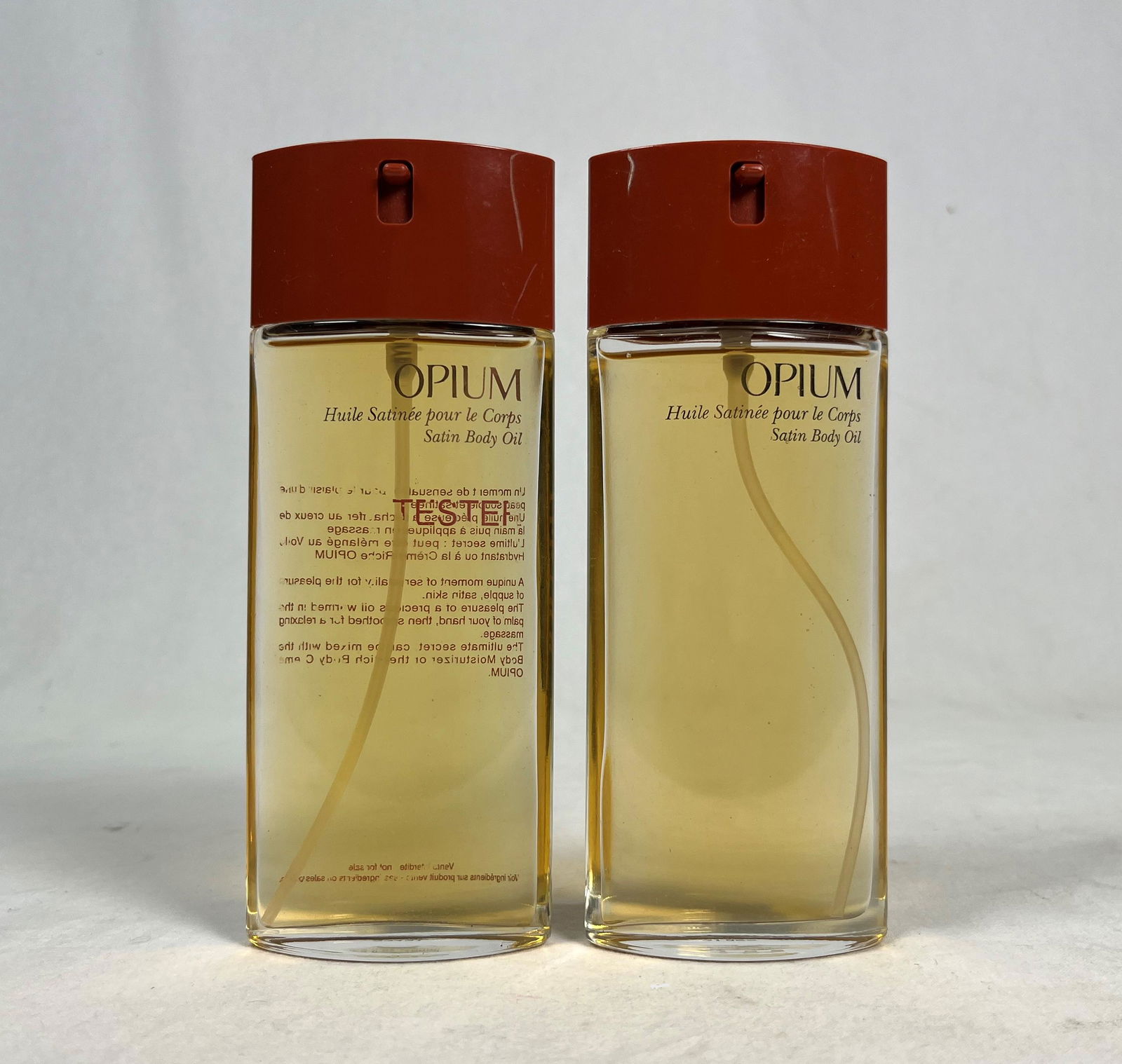 Yves Saint Laurent Perfume Opium lot of 2: 2x Yves Saint Laurent Perfumed Satin Body Oil 3.3FL OZ Opium New Huile Satinee Pour La Corps Store Display ? Perfume Bottle Lot Please look at Photos Closely Out of a New York City Estate