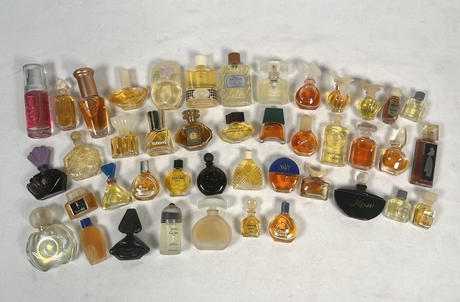 Lot of Perfume Bottles: Large Collection of Miniature Perfume Bottle Eau Sauvage Christian Dior L'Interdit Givenchy Pasha de Cartier Ysatis Givenchy Crepe de Chine F. Millot Azzaro Paris Pavlova Paris Please look at Photos C