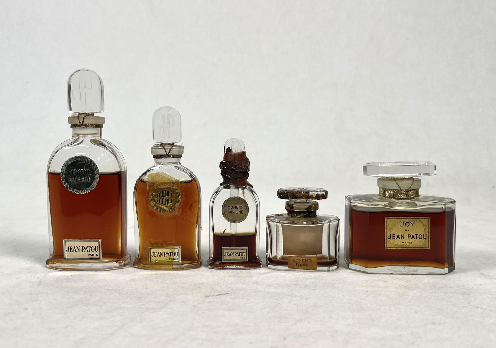Lot of Jean Patou Perfumes: Lot of Vintage Jean Patou Perfume Bottle lot 2x Moment Supreme 1x Amour Amour 2x Joy Please look at Photos Closely Out of a New York City Estate
