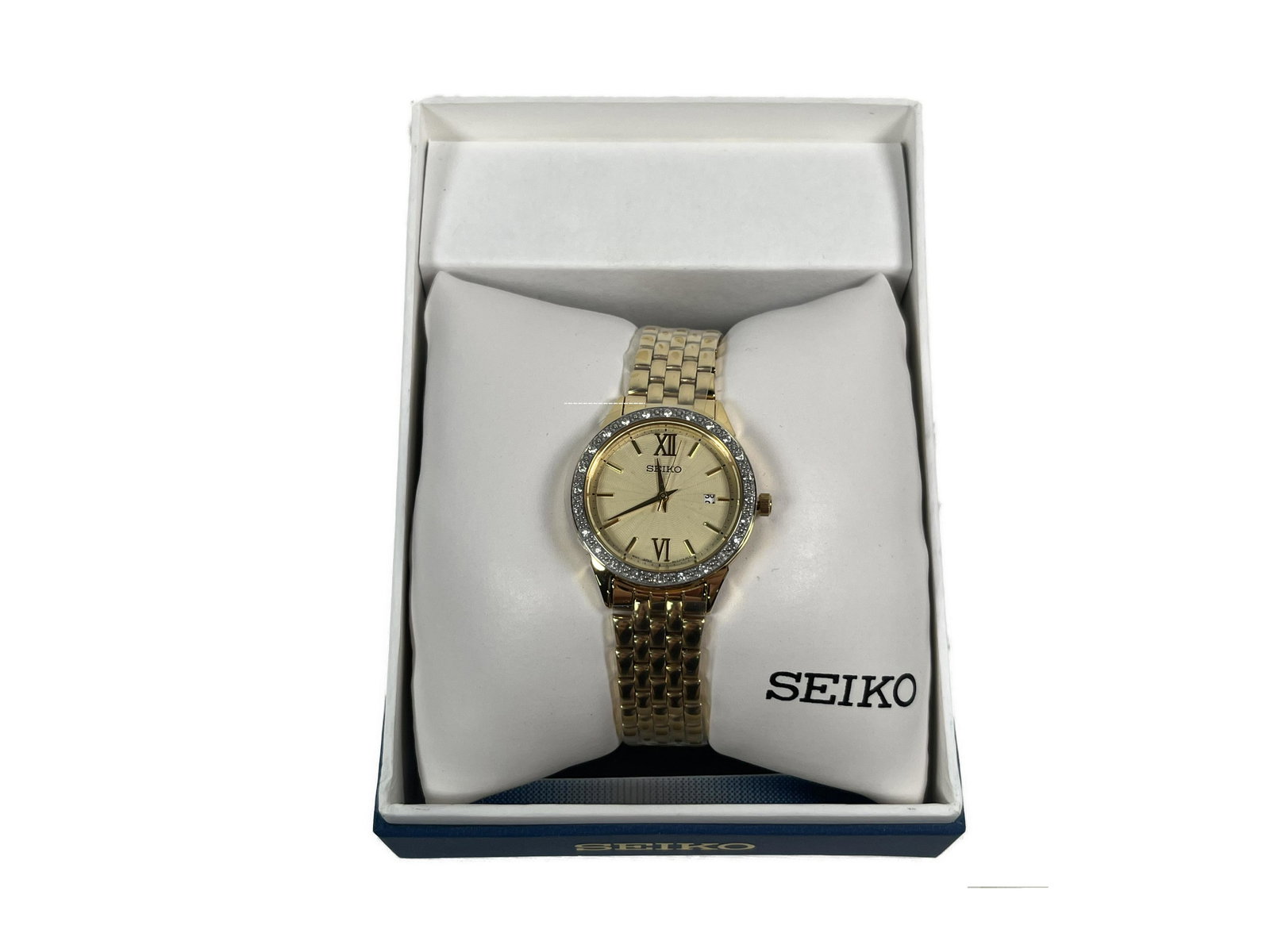 Seiko Watch: Seiko Watch Diamond Accent Gold/White Dial, Analog Display, Date Display, Swarovski Crystals on Bezel, Pull/Push Crown, Deployment Clasp Gold Tone Stainless Steel Case Gold Tone Stainless Steel Bracel