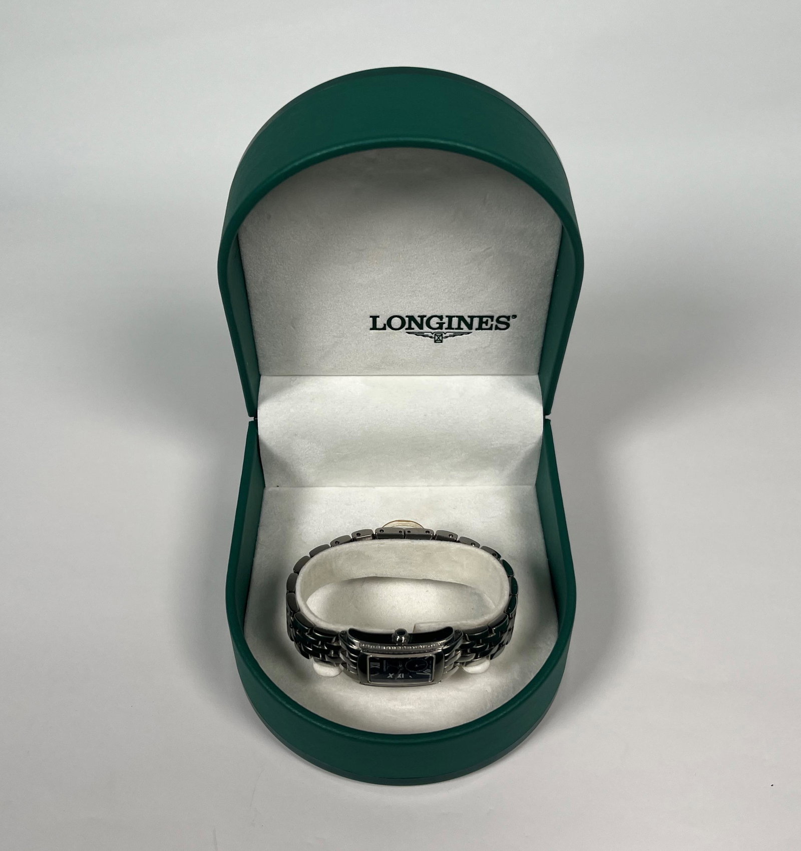 Longines DolceVita Diamond Watch: Womens Longines Dolce Vita Diamond Watch Stainless Steel Bezel Set with 32 Diamonds 16 on Each Side Navy Blue Dial Stainless Steel Case with a Stainless Link Bracelet quartz Movement Scratch Resistant