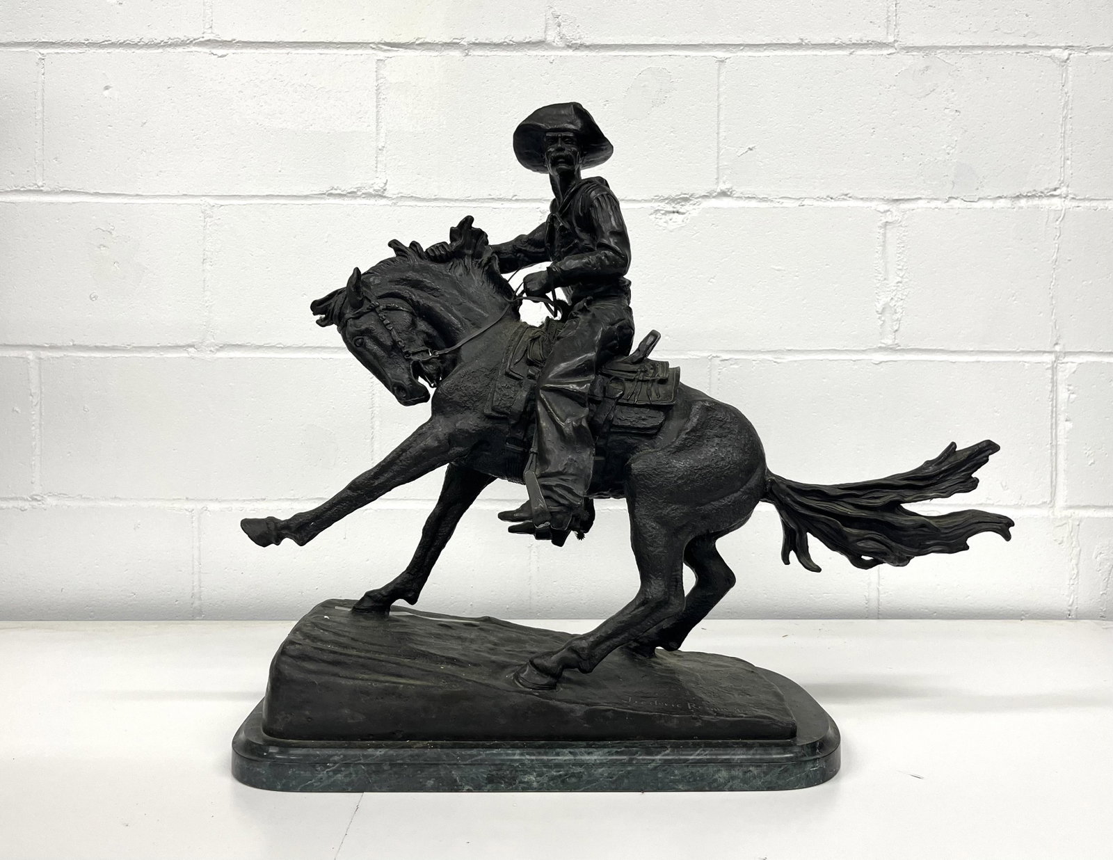 Frederic Remington (US 1861-1909) Bronze Sculpture: Frederic Remington (American 1861-1909) Monumental Bronze Cowboy Sculpture Figural with Dark Renaissance Brown Patina 22" H x 19.5" L x 9.5" W Item is in Good Overall Condition Please look at Photos C