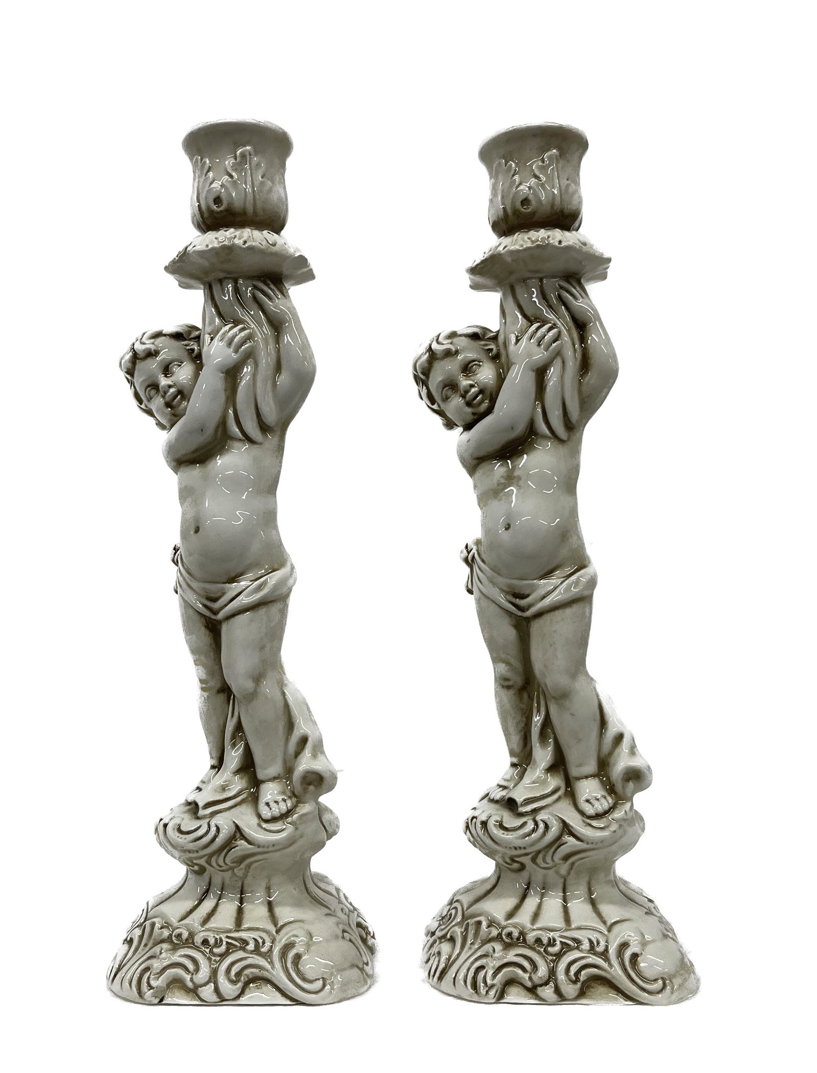 Ceramic Cupid Candlestick Pair: Vintage Carraro Ceramic Cupid or Cherub Candle Stick Holder Pair Italian Made Dimensions 12 inches Tall semi nude boy Out of a South Shore Long Island Estate