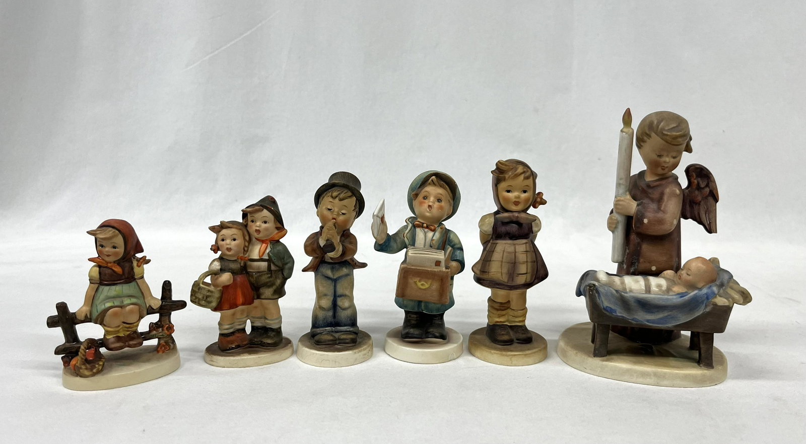 Western German Goebel Hummel Figurines: Lot of Six Antique Western Germany Goebel Hummel Figurine 1x Watchful Angel #194 86 Signed W. Goebel Underneath 6.5" H 1x Postman #119 Western Germany Goebel Hummel 5" H 1x Companions #370 Marked R Un