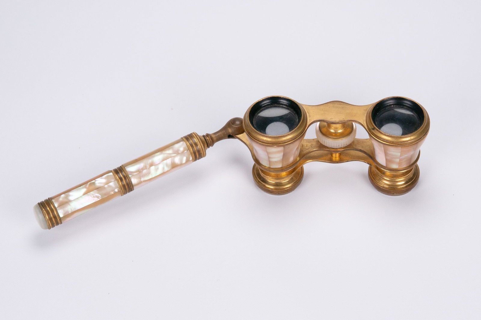 French Brass And Mother of Pearl Inlaid Opera Glasses: French Brass And Mother of Pearl Inlaid Opera Glasses With Extension Handle Unmarked 3.75W x 8.5L x 2.125D In Overall Good Condition Please look at Photos Closely Out of a New York City Estate