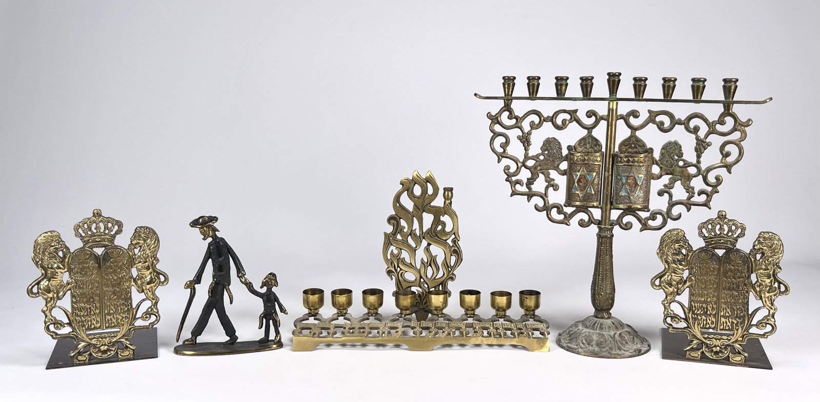 Judaica Large Lot: Judaica Large Lot Include: 1.Brass Menorah Hanukkah Signed in the Back & Underneath Oppenheim Israel11" L4"W 7.5"H 2.Large Brass menorah Hanukkah 10 Commandments 2 Lions Wine grapes 11.5"H 11.5"L 4" W