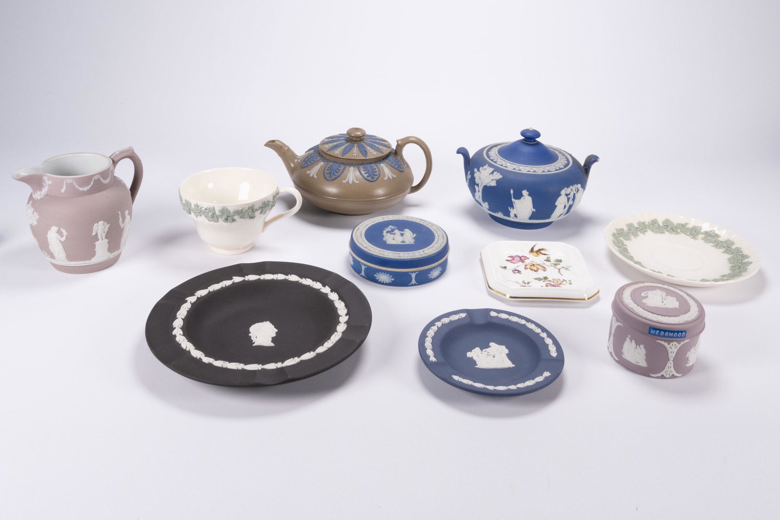 Wedgwood Assorted Porcelain Jasperware Lot: Wedgewood Assorted Porcelain Jasperware Lot of Nine 9 Each item Stamped Underneath: "Wedgwodd England", Including: 1.Wedgwood Blue Jasperware Neoclassical Sugar Bowl with Lid 4" H x 6 1/4" W 2.Brown w