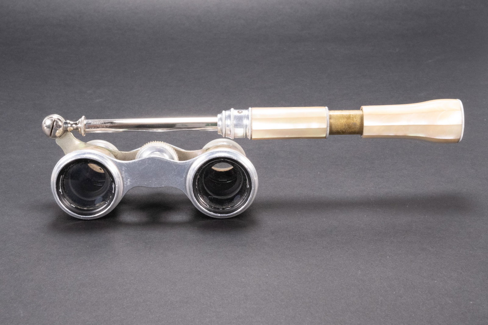 French Mother of Pearl Opera Glasses: French Mother of Pearl Inlaid Opera Glasses Binoculars with Extension Handle and Carrying Bag Unmarked Binoculars 3.75"L x 1.75"W x 1.25" D with Handle 8.5"L In Overall Good Condition Please look at P