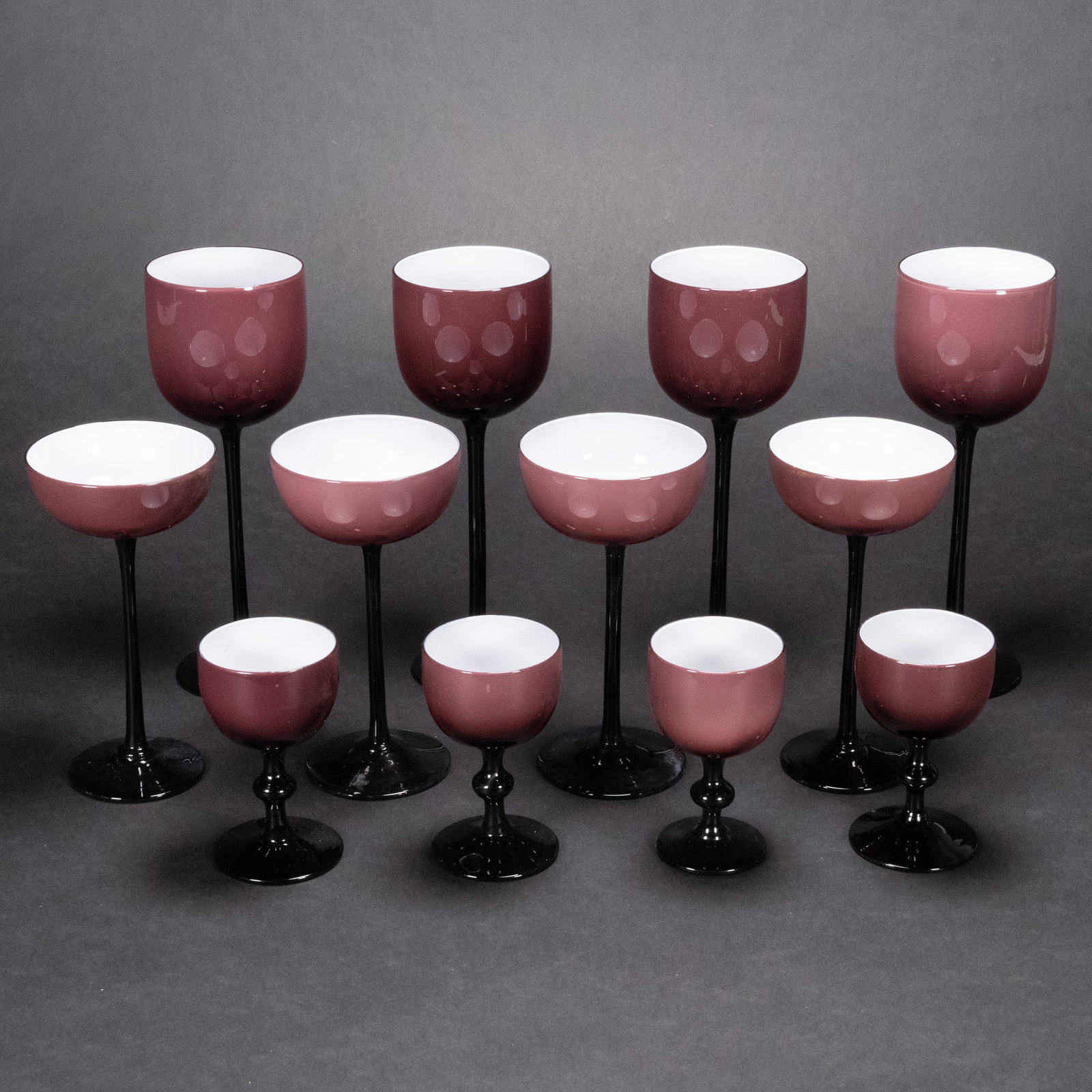 Carlo Moretti Empoli Murano Amethyst Cased White Mid-Century 12pc: Mid-Century Modern Carlo Moretti Empoli Murano Amethyst Cased White Stemware 12pc Set Italy Circa 60's Tall Stems Amethyst Exterior White Interior (4) Wine Glasses 9.5" H (4) Goblets 7" H (4) Cordial