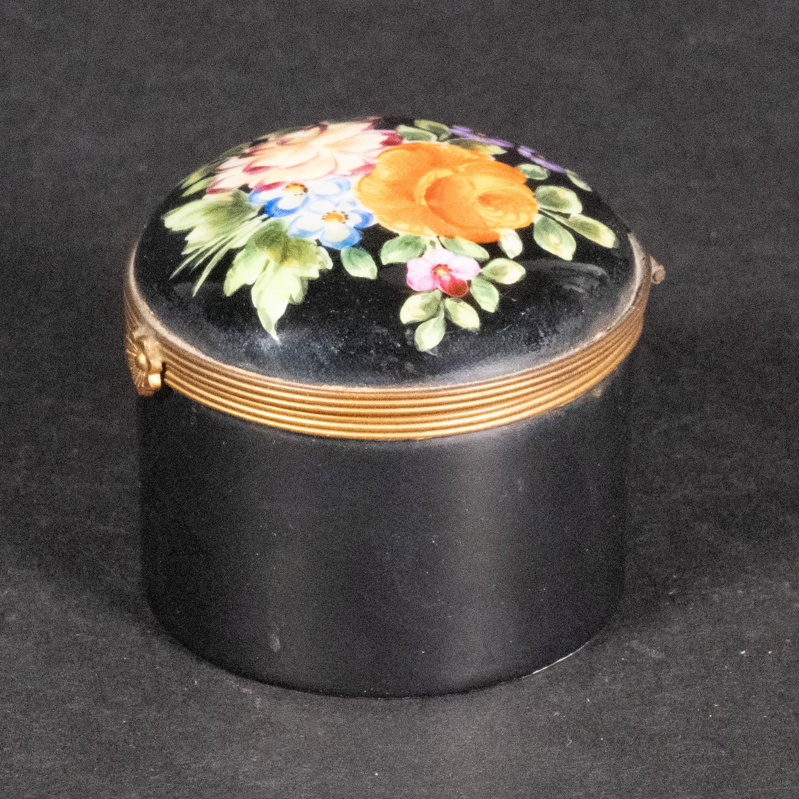 Tiffany & Co Private Stock Le Tellec Porcelain Trinket Box: Glazed Enameled Porcelain Jewelry vanity Trinket Box Black Background Hand Painted Floral Motif on Lid White Interior Underside Mark: " Tiffany & Co Private Stock Hand Painted Made in France 659 " 2"H
