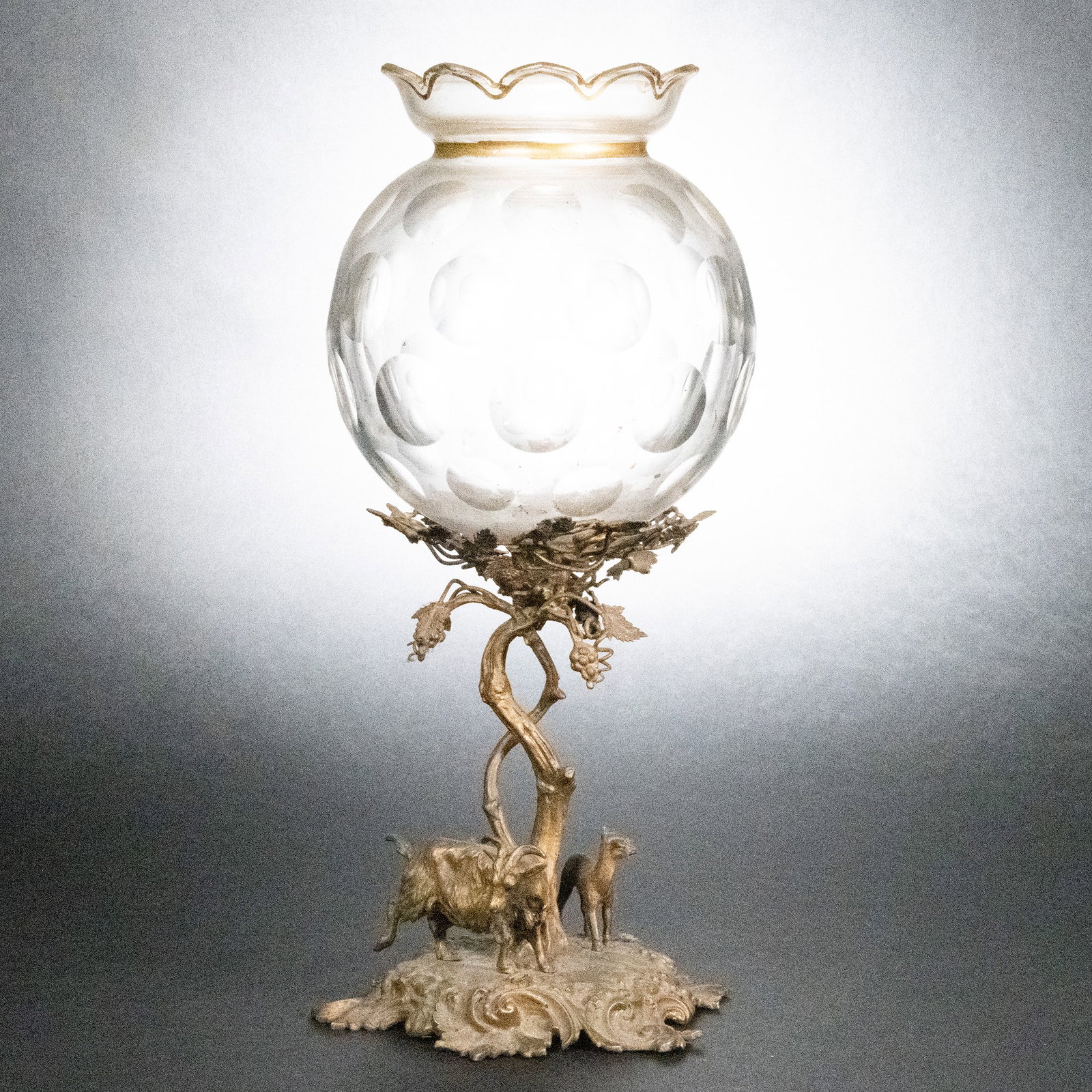 Gilt Bronze & Cut Glass Epergne Centerpiece: Gilt Bronze & Cut Glass Epergne Centerpiece The Epergne of Two Goats Under The Grape Vine Tree With Cut Glass Bowl Gilt Bronze High Detail 17 3/4"H x Base 8"W Bowl 8,5"H x 7"W In Overall Good Conditio