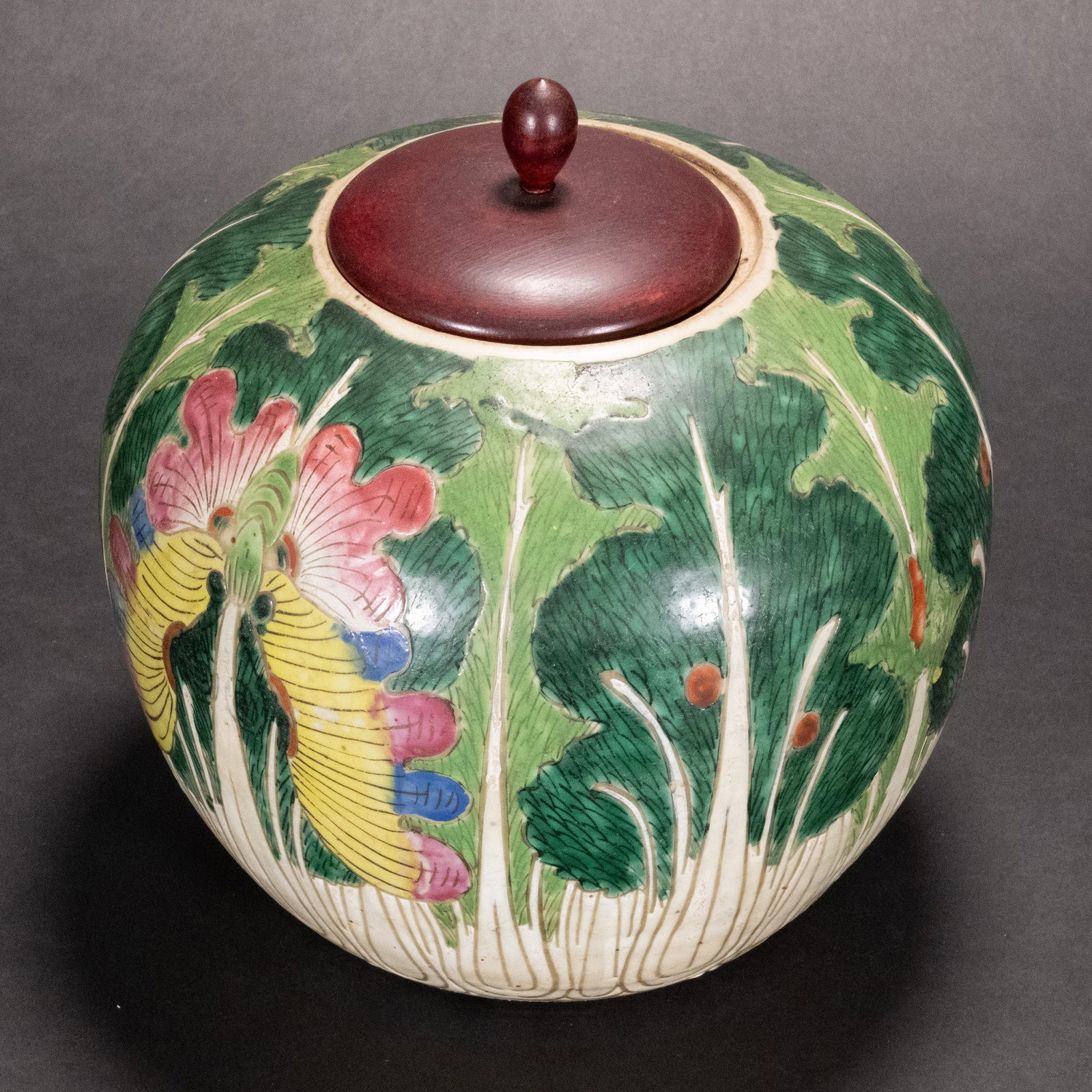 Chinese Famille Rose Ginger Jar Qing Dynasty: Chinese Porcelain Cabbage and Moth Decorated Glazed Ginger Jar In Globular Shape with Rose Wood Cap Lid 9 Inches"H x 8 Inch Diameter Due to The Age and use Minor Glaze Loss Above Mothe Head Can Be Rap