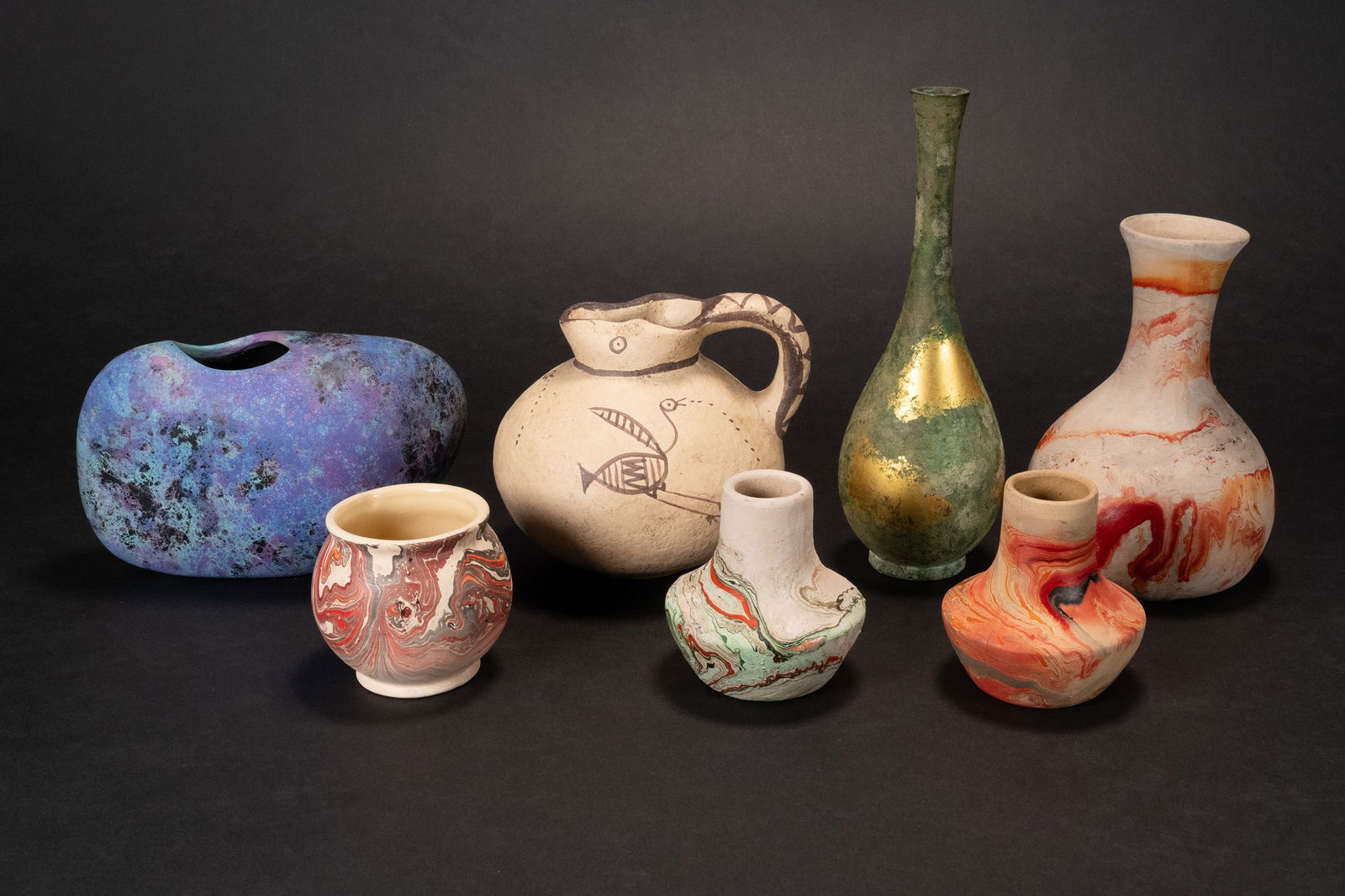 Collection Of Clay & Ceramic Pottery 7Pcs: Collection Of Clay & Ceramic Brass Pottery 7 Pieces Lot Comprising: 1x Raku Ceramic Vase Purple Blue Color In Oval Stone Like Shape Hand Made Circa Middle Century Signed Underneath Base 4 7/8"H x 6 3/