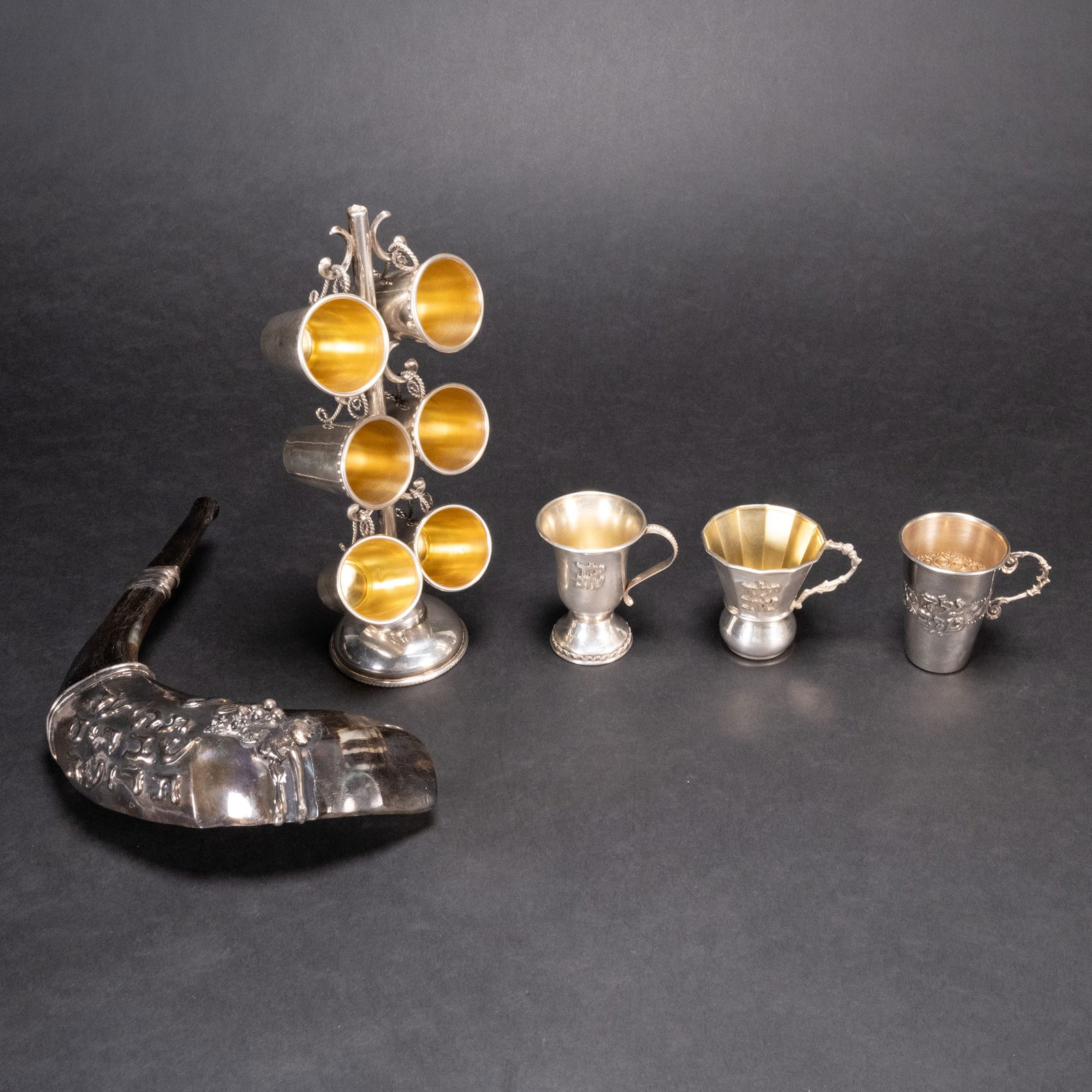 Judaic Sterling Silver Kiddush Cup & Shofarh Collection Lot: Judaica Sterling Silver Kiddush Cup and Shofarh Collection Lot Total Weight Of Sterling Silver: approx 330 Grams Lot Is Comprising: 1x Shofar Decorated With Sterling Silver Plaque With Hebrew Inscript