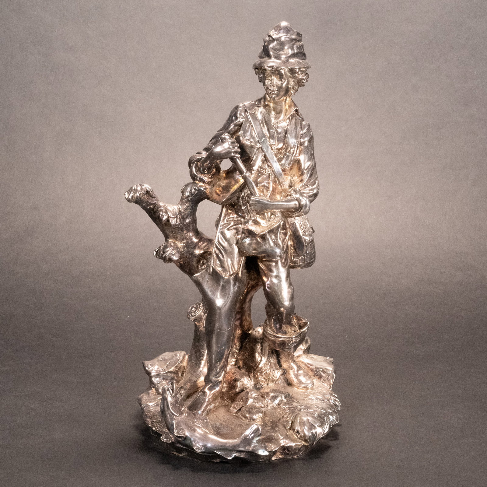 Sterling Silver Young Boy Sculpture: Realistic Sterling Silver Statue of a Young Fisher Boy Fishing Reeling in a Fish by his Feet Signed illegible 12" H in Overall Good Condition Please look at Photos Closely figurine figural grouping gr