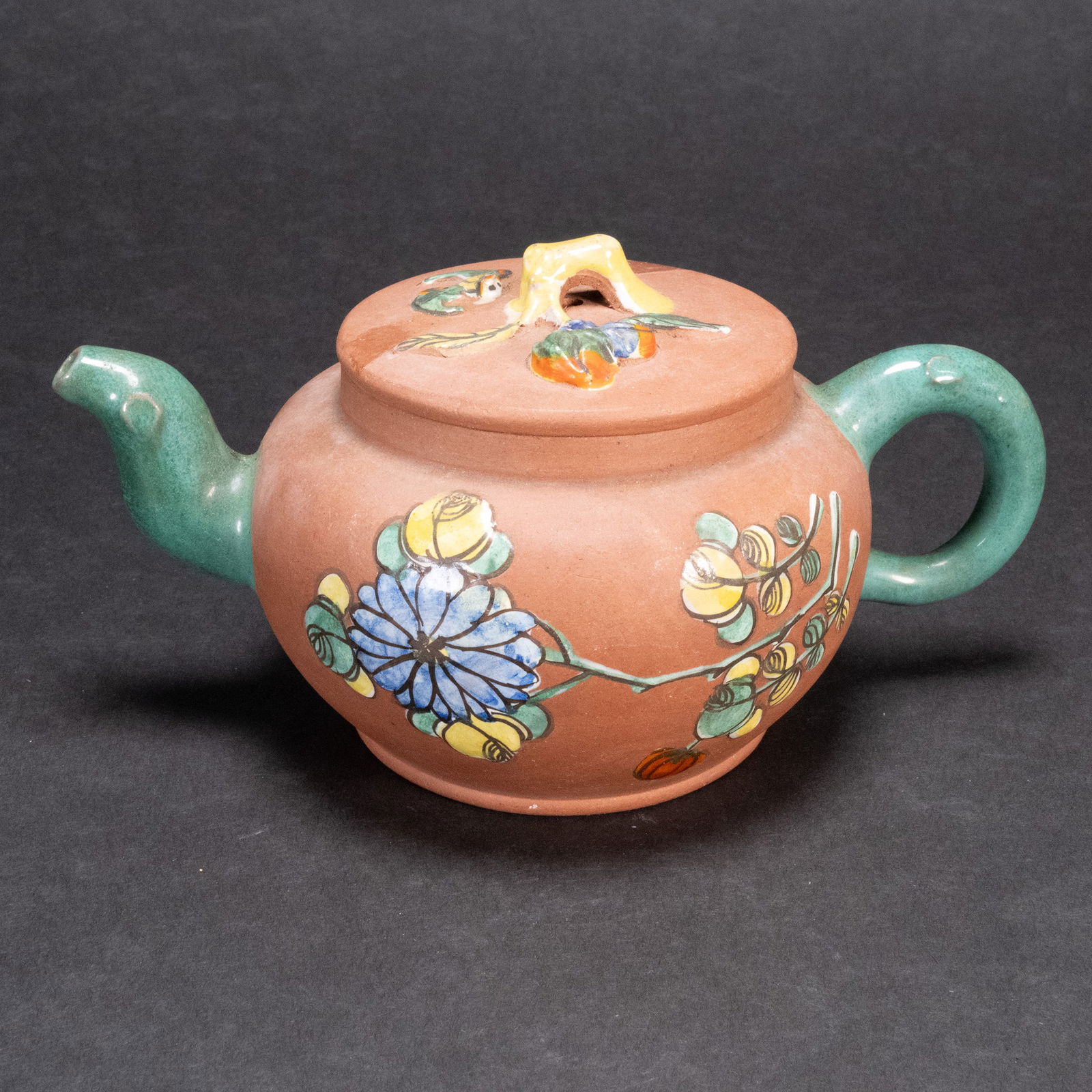 Chinese Yixing Polychrome Zisha Teapot: Chinese Yixing Polychrome Enameled Ceramic Zisha Teapot Flattened Globular Form With A C-Shaped Handle And Curved Spout The Red Clay Body And Cover Finely Painted With Blossoms Flowers Stamped On The