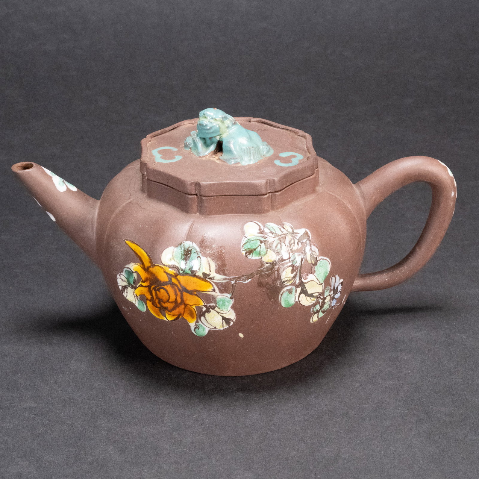 Chinese Yixing Polychrome Ceramic Zisha Teapot: Chinese Yixing Polychrome terracotta Porcelain Zisha Teapot With Foo Dog Lid Handle Motif And Flattened Globular Form With Handle And Circular Spout And Tea Infuser Brown Clay Body And Cover Finely Pa
