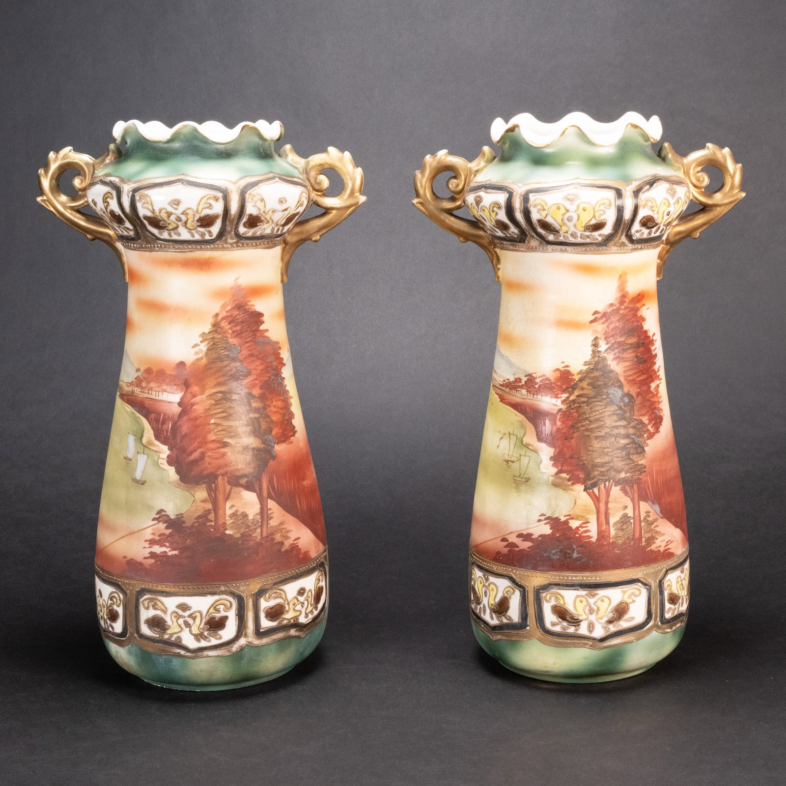Nippon MM Moriage Ceramic Vase Pair: 19th Century Nippon MM Moriage Pair of Vases Double Handed Scalloped Rim Moriage Gold Green Scenic Landscape Hand Painted Motif Of Lake Trees And Lake Stamped Underneath Base stamp Indicating period M