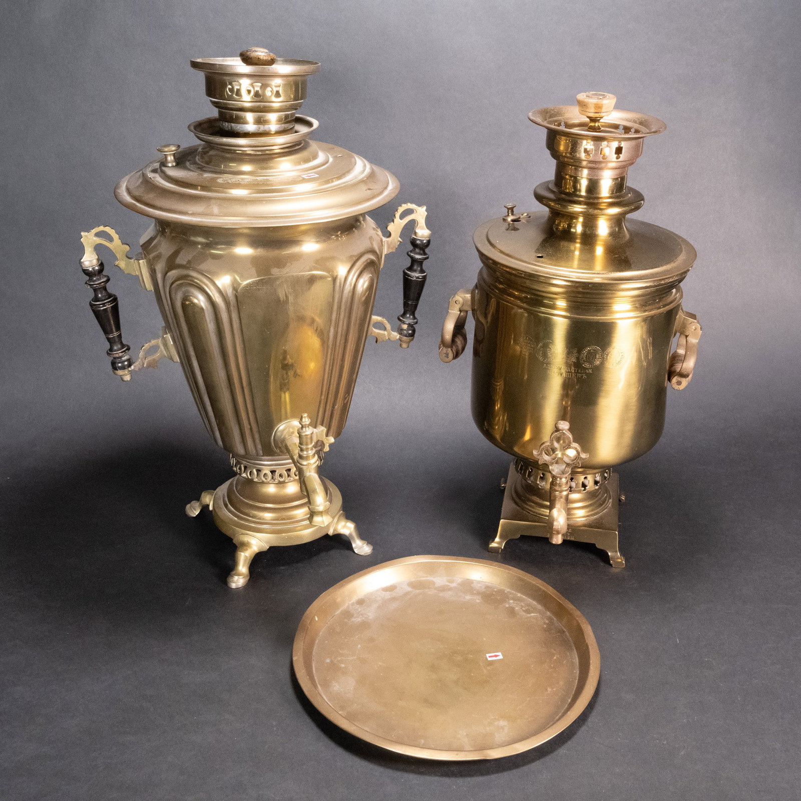 19th c. Alexander Batashev Tula Russian Samovar Lot: 19th Century Alexander Batashev Russian Samovar and Round Tray Lot Brass Footed Base 19" Tall 9" Diameter 5" Square Base Very small Dings With Russian Text Printed on Top Body and Base 4" Nozzle With 